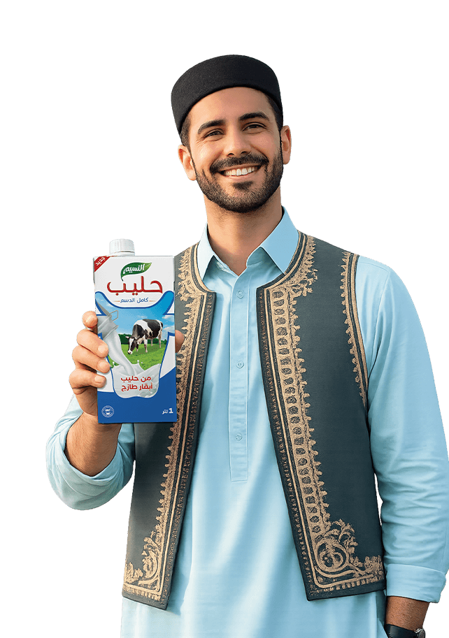 رجل بالزي الوطني يحمل عبوة حليب النسيم